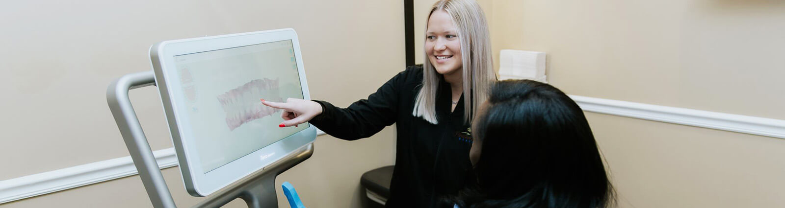 staff member speaking with a patient